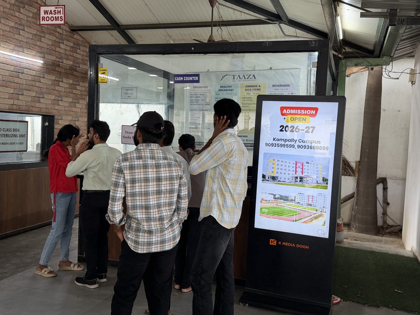 Admissions campaign on a KMEDIA digital standee